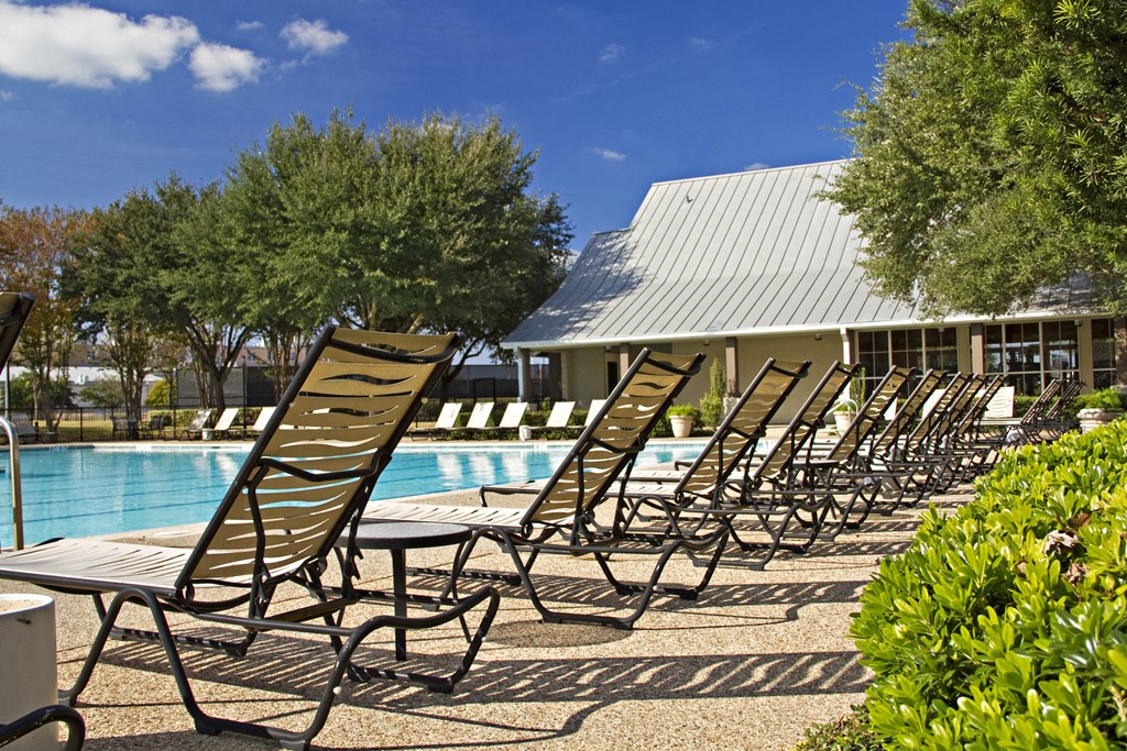 Pool with lounge chairs Pool with lounge chairs at Monterey Ranch, Texas, 78749